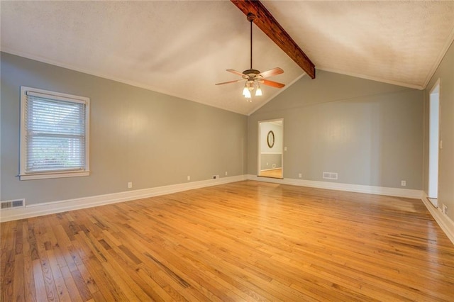 foyer entrance featuring wood-type flooring, baseboards, a textured ceiling, and crown molding