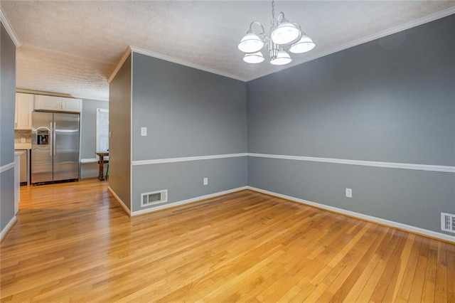 unfurnished living room featuring light wood finished floors, ceiling fan, baseboards, and a brick fireplace