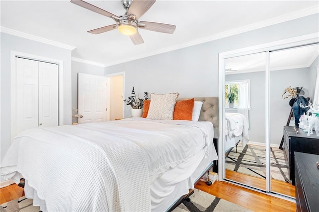 bedroom featuring light wood-style floors, ornamental molding, ceiling fan, and baseboards