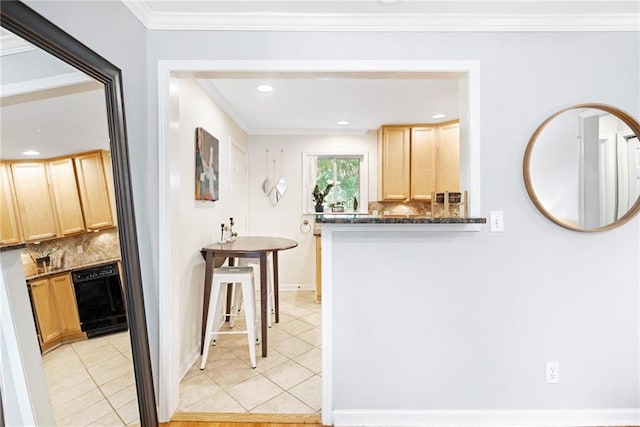 kitchen with light brown cabinets, backsplash, light tile patterned floors, ornamental molding, and dark stone countertops