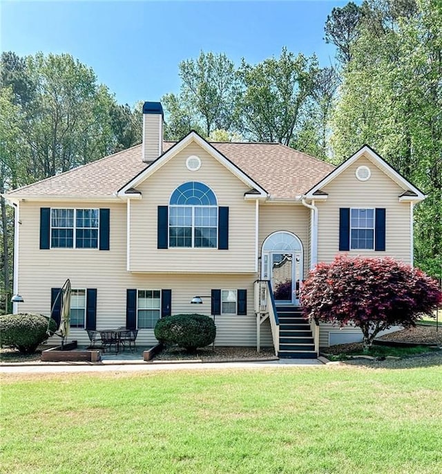 3809 Autumn View Ln NW, Acworth, GA 30101 - bi-level home featuring a chimney, a front yard, and roof with shingles