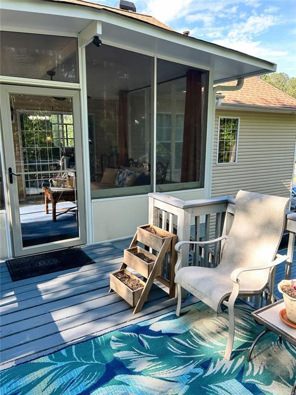 3809 Autumn View Ln NW, Acworth, GA 30101 - wooden deck with a sunroom
