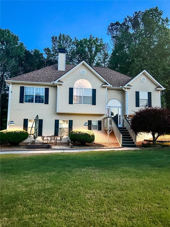 3809 Autumn View Ln NW, Acworth, GA 30101 - raised ranch with a chimney, a front yard, and roof with shingles