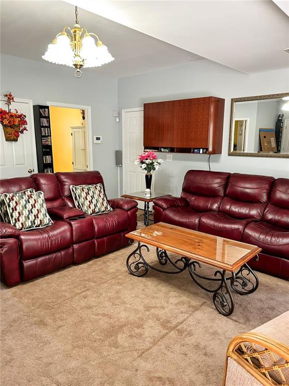 3809 Autumn View Ln NW, Acworth, GA 30101 - carpeted living room featuring a chandelier