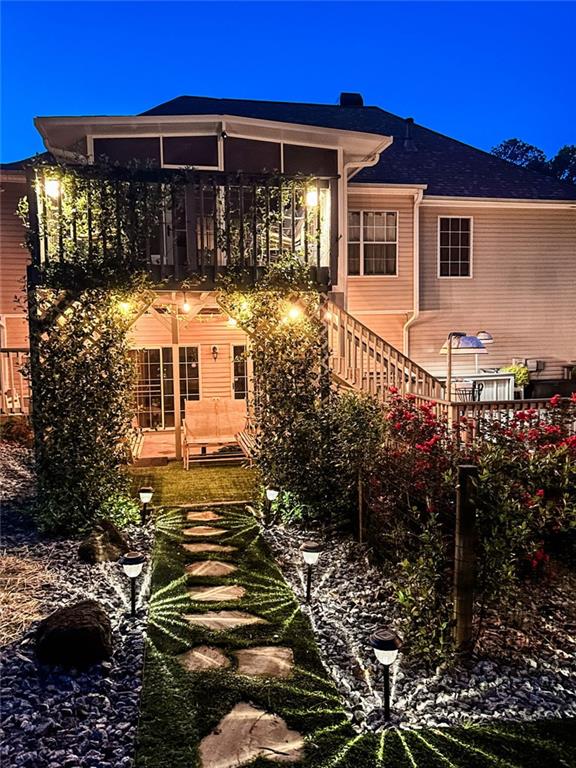3809 Autumn View Ln NW, Acworth, GA 30101 - rear view of property with stairway and a sunroom