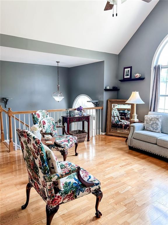 3809 Autumn View Ln NW, Acworth, GA 30101 - living area with ceiling fan, wood finished floors, and high vaulted ceiling