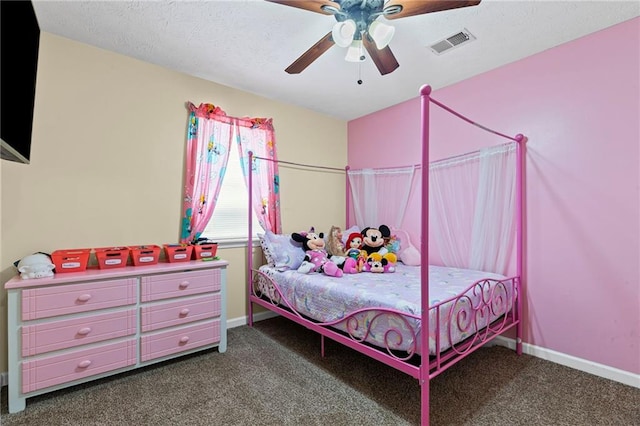 carpeted bedroom with visible vents, a textured ceiling, baseboards, and a ceiling fan