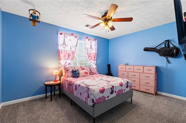 bedroom with a ceiling fan, baseboards, a textured ceiling, and carpet flooring