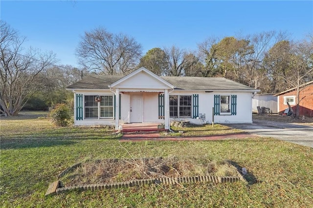 ranch-style house with a front lawn