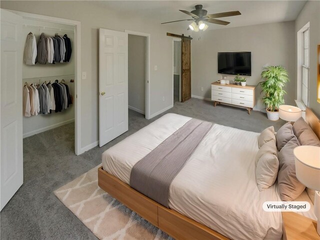 6941 Gallant Cir SE Unit 10, Mableton, GA 30126 - carpeted bedroom with baseboards, a closet, a barn door, and a spacious closet