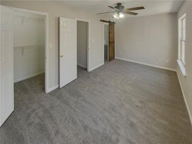 6941 Gallant Cir SE Unit 10, Mableton, GA 30126 - unfurnished bedroom with a closet, carpet, baseboards, ceiling fan, and a spacious closet