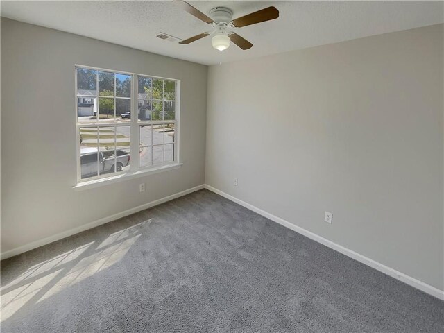 6941 Gallant Cir SE Unit 10, Mableton, GA 30126 - unfurnished room with carpet, baseboards, a textured ceiling, visible vents, and a ceiling fan