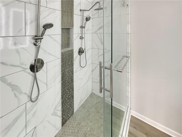 6941 Gallant Cir SE Unit 10, Mableton, GA 30126 - full bath featuring a shower stall, baseboards, and wood finished floors