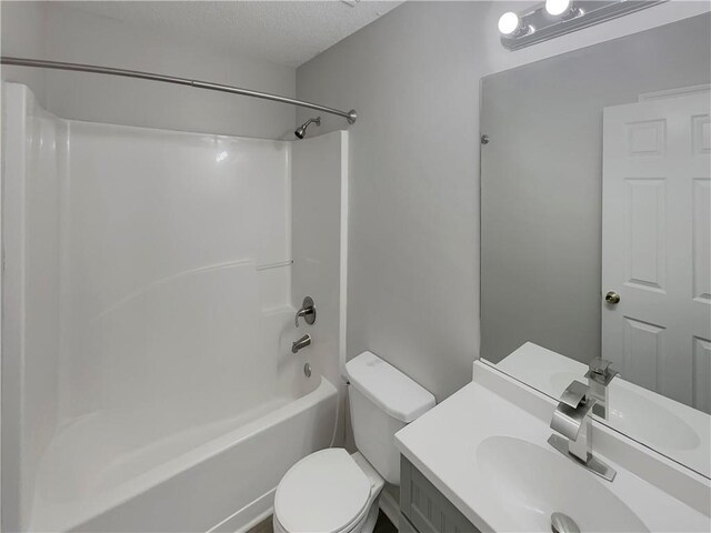 6941 Gallant Cir SE Unit 10, Mableton, GA 30126 - full bathroom with toilet, vanity, shower / bath combination, and a textured ceiling