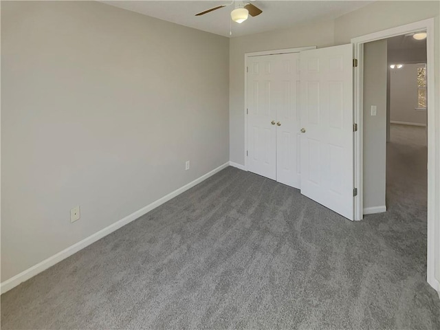6941 Gallant Cir SE Unit 10, Mableton, GA 30126 - unfurnished bedroom featuring a closet, baseboards, dark carpet, and ceiling fan