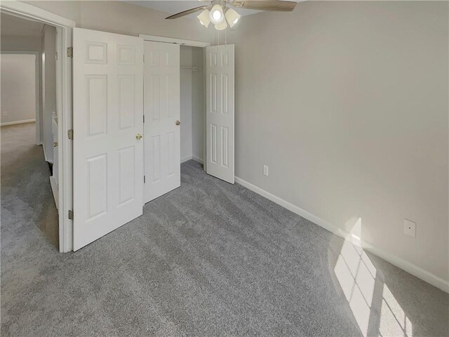 6941 Gallant Cir SE Unit 10, Mableton, GA 30126 - unfurnished bedroom featuring carpet floors, a closet, baseboards, and ceiling fan