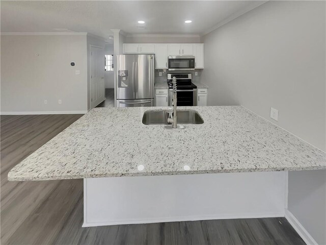 6941 Gallant Cir SE Unit 10, Mableton, GA 30126 - kitchen featuring crown molding, light stone counters, dark wood finished floors, and appliances with stainless steel finishes