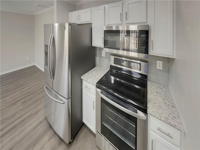 6941 Gallant Cir SE Unit 10, Mableton, GA 30126 - kitchen featuring white cabinets, stainless steel appliances, backsplash, and crown molding