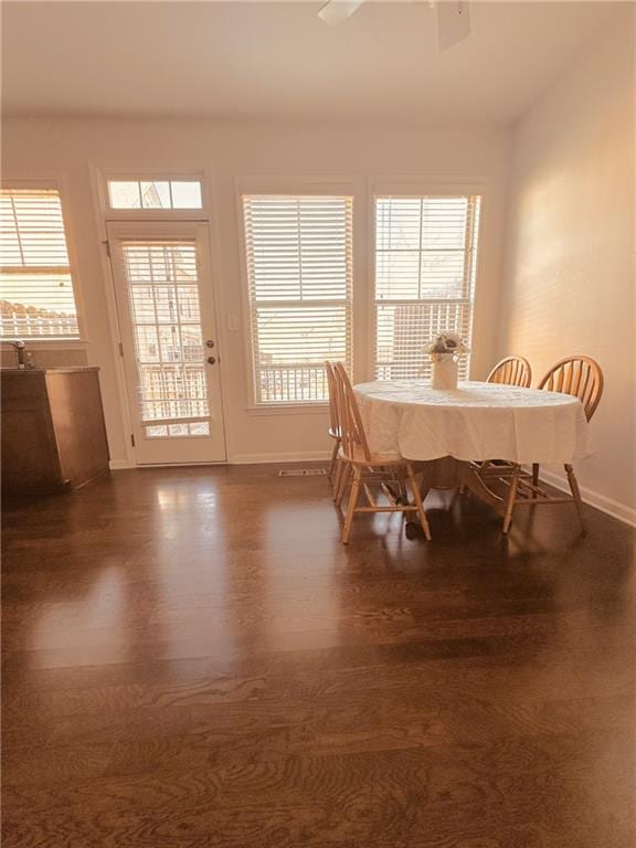 4438 Lassen Ct, Suwanee, GA 30024 - dining space featuring dark wood-style floors, healthy amount of natural light, and a ceiling fan
