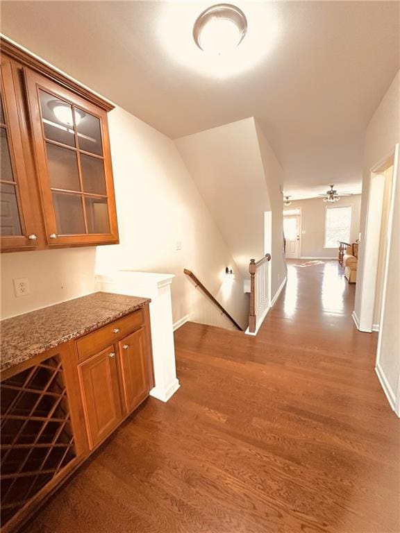 4438 Lassen Ct, Suwanee, GA 30024 - hallway featuring an upstairs landing and dark wood finished floors