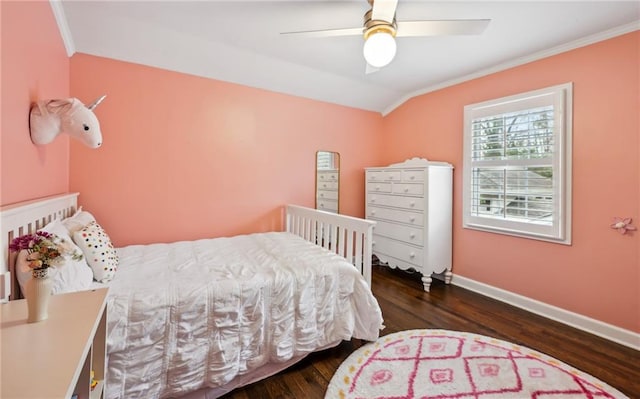 bedroom featuring lofted ceiling, crown molding, dark hardwood / wood-style floors, and ceiling fan