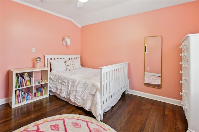 bedroom featuring hardwood / wood-style flooring, vaulted ceiling, ornamental molding, and ceiling fan