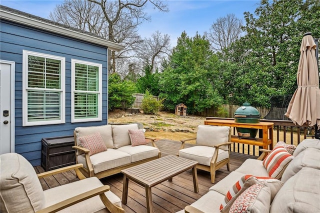 wooden deck with area for grilling and outdoor lounge area