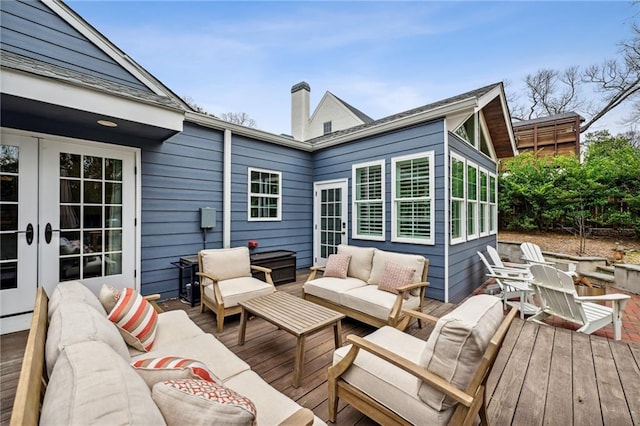 deck featuring an outdoor living space and french doors