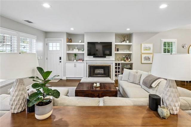 living room with hardwood / wood-style flooring and a wealth of natural light