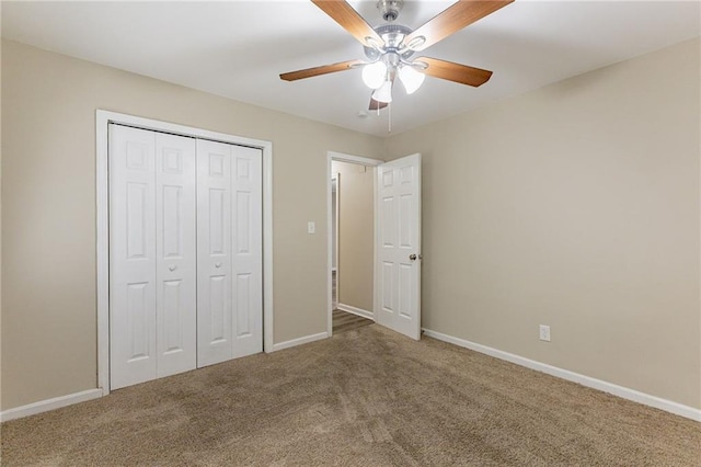 unfurnished bedroom with a closet, carpet flooring, and ceiling fan