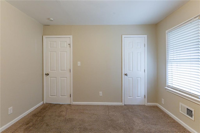 spare room featuring carpet floors