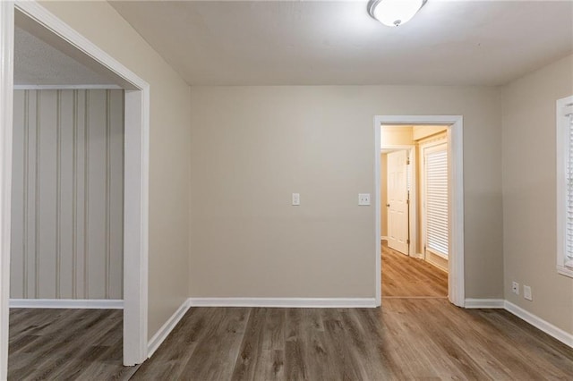 empty room featuring hardwood / wood-style flooring