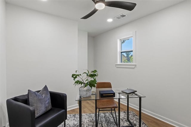 office space with baseboards, visible vents, recessed lighting, and wood finished floors