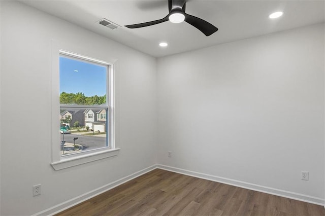 spare room featuring recessed lighting, a ceiling fan, visible vents, and wood finished floors