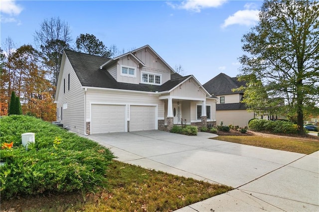 craftsman inspired home featuring covered porch and a garage