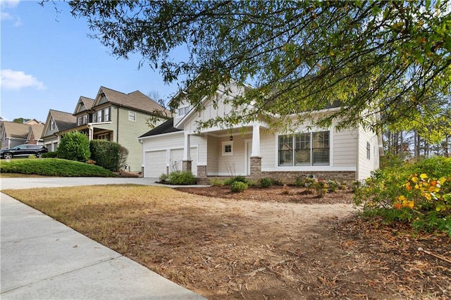 view of front of home featuring covered porch and a garage