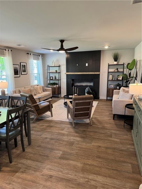 719 Windstream Dr, Lagrange, GA 30241 - living area with healthy amount of natural light, ceiling fan, wood finished floors, and a fireplace