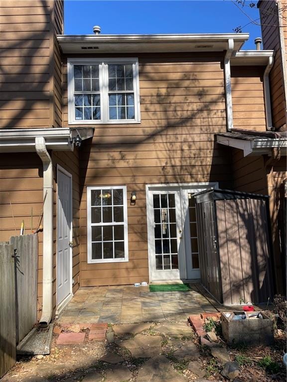 back of house with a patio area and fence