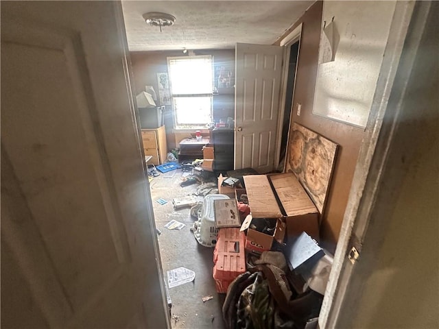 miscellaneous room with a textured ceiling