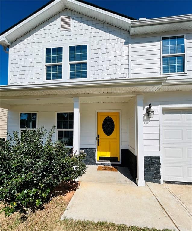 property entrance with a garage