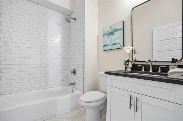 bathroom with toilet, vanity, and shower / bathing tub combination