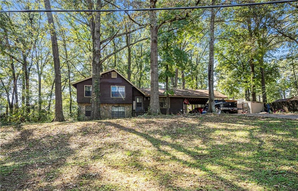 back of house with a yard