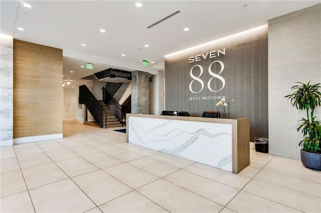 reception area featuring stairway and visible vents
