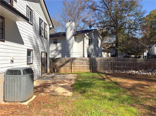 view of yard featuring a patio area and central AC unit