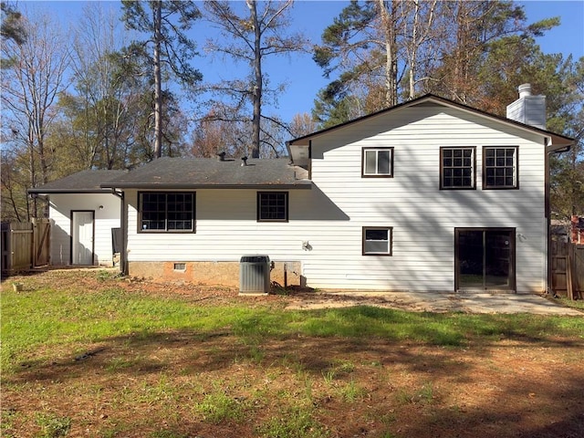 back of property featuring a patio, cooling unit, and a lawn