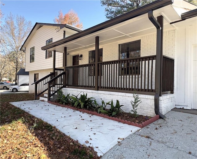 view of side of home featuring a porch