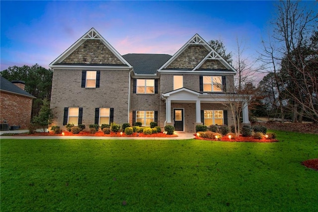 craftsman-style home featuring a yard