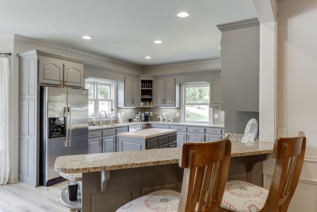 2623 Lindsey Grace Ln, Buford, GA 30519 - kitchen featuring stainless steel fridge with ice dispenser, gray cabinets, a peninsula, plenty of natural light, and recessed lighting