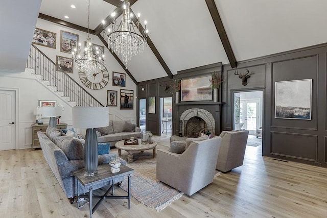 2623 Lindsey Grace Ln, Buford, GA 30519 - living room with a decorative wall, high vaulted ceiling, stairs, beam ceiling, and light wood-style flooring