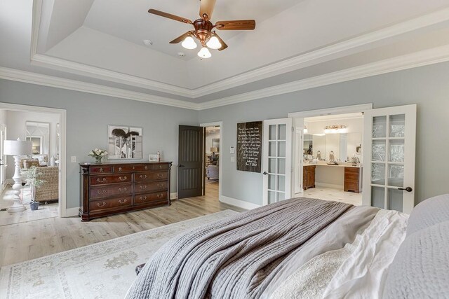 2623 Lindsey Grace Ln, Buford, GA 30519 - bedroom with a raised ceiling, ensuite bath, wood finished floors, baseboards, and crown molding